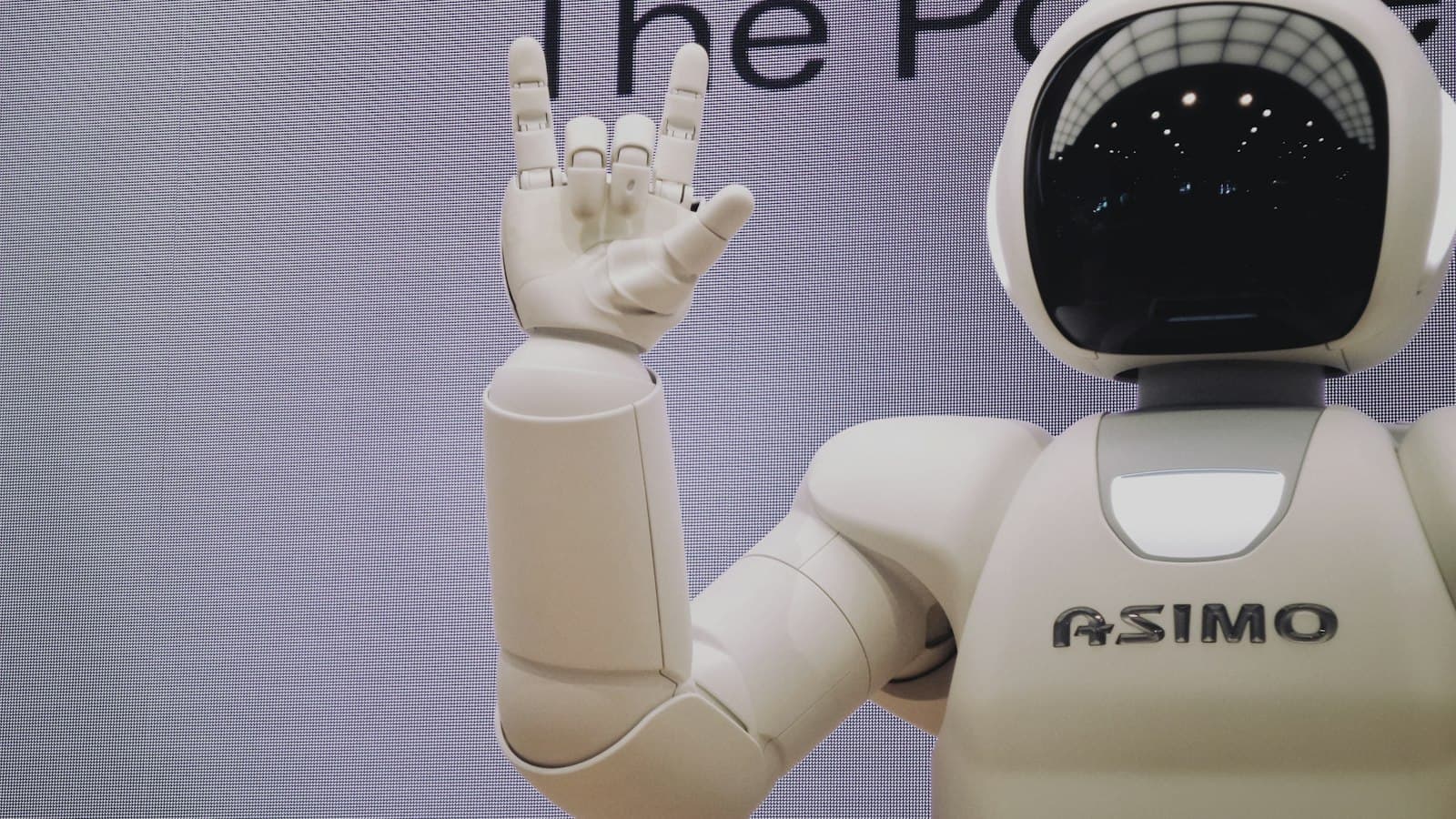 Robot hand reaching toward a human hand